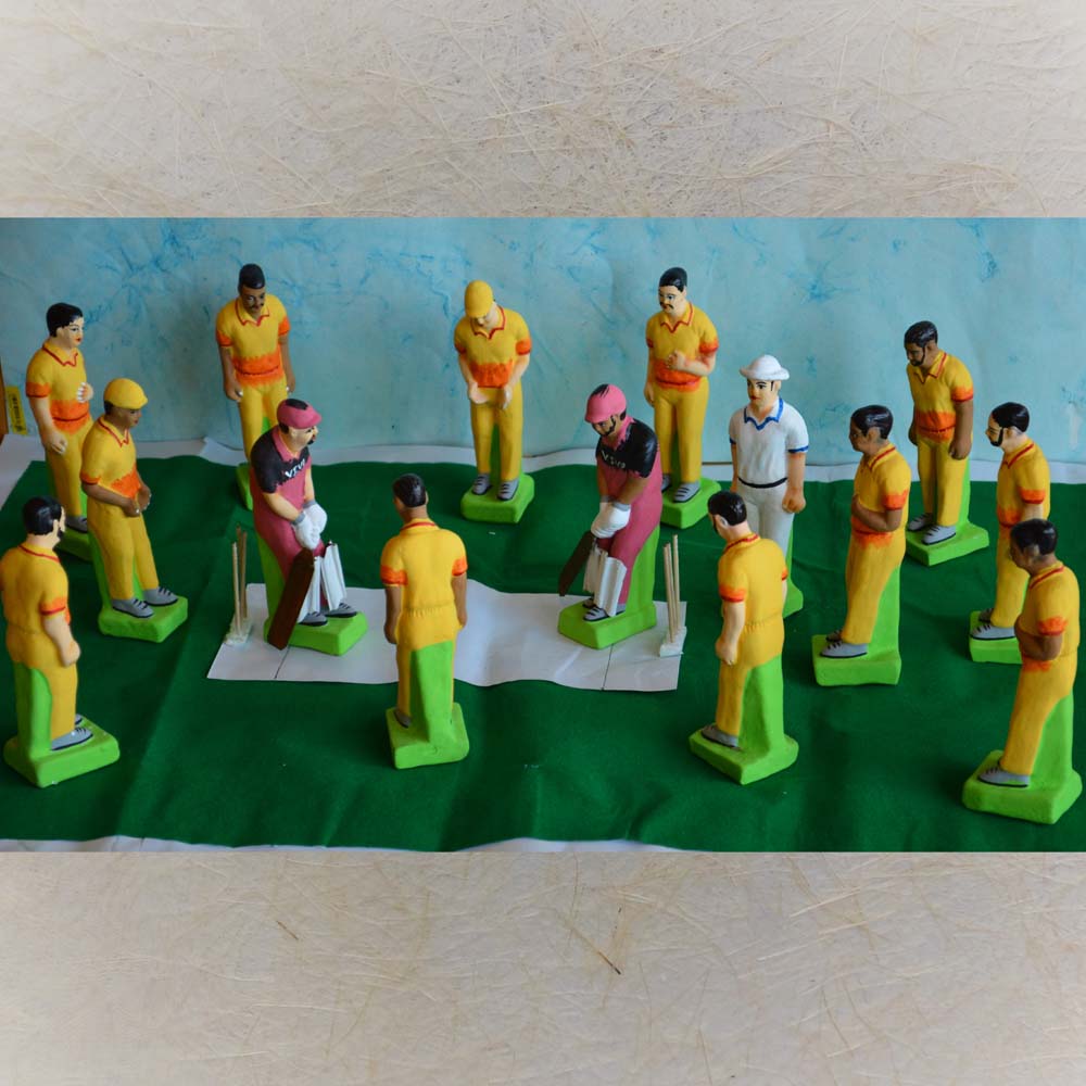 Handcrafted Navaratri Cricket Set with colorful figurines of players, umpires, and a detailed cricket field for Golu decor.