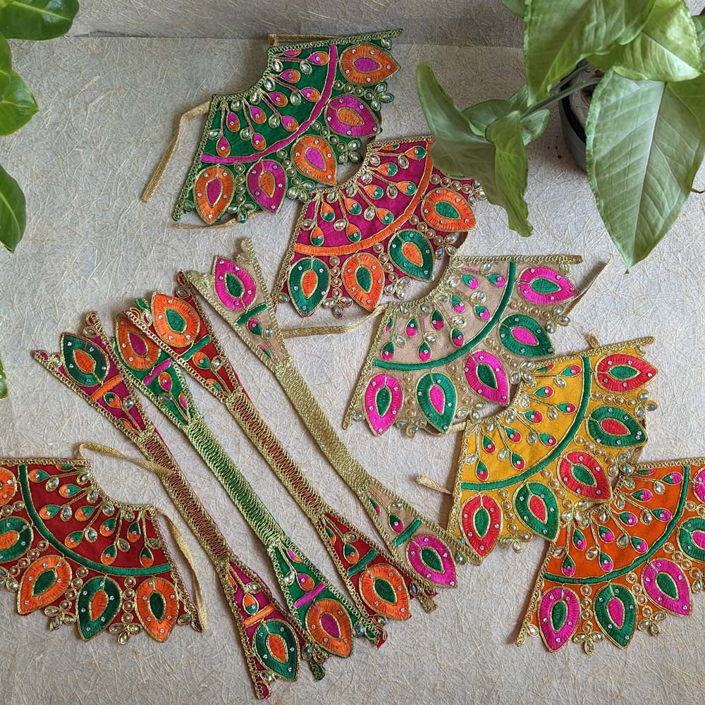 Colorful embroidered Lehenga Patka pieces with vibrant designs featuring intricate patterns and sparkling embellishments, perfect for festive and religious decor.
