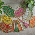 Handcrafted decorative Lehenga Patka set with golden embroidery, sequins, and bead embellishments in vibrant colors for Navaratri Golu or festive décor.