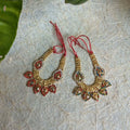 A pair of 4-inch traditional beaded fabric necklaces with multicolor stone embellishments and red adjustable threads, displayed on a textured surface.