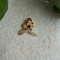 2-inch stone-studded Mukut with red, black, and gold accents for deity idol decoration.