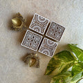 Hand-Carved Wooden Block Incense Holder Set with Floral Patterns and Brass Leaf-Shaped Accents.