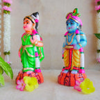 Handcrafted Navarathri Golu Dolls featuring Lord Krishna with a flute and Andal in traditional attire with vibrant colors.