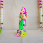 Handcrafted Navarathri Golu Doll of Vastu Lakshmi adorned in a vibrant green saree with intricate detailing, blessing devotees.