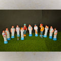 Handcrafted cricket figurine set featuring players, umpires, and equipment with vibrant detailing for Navaratri Golu.