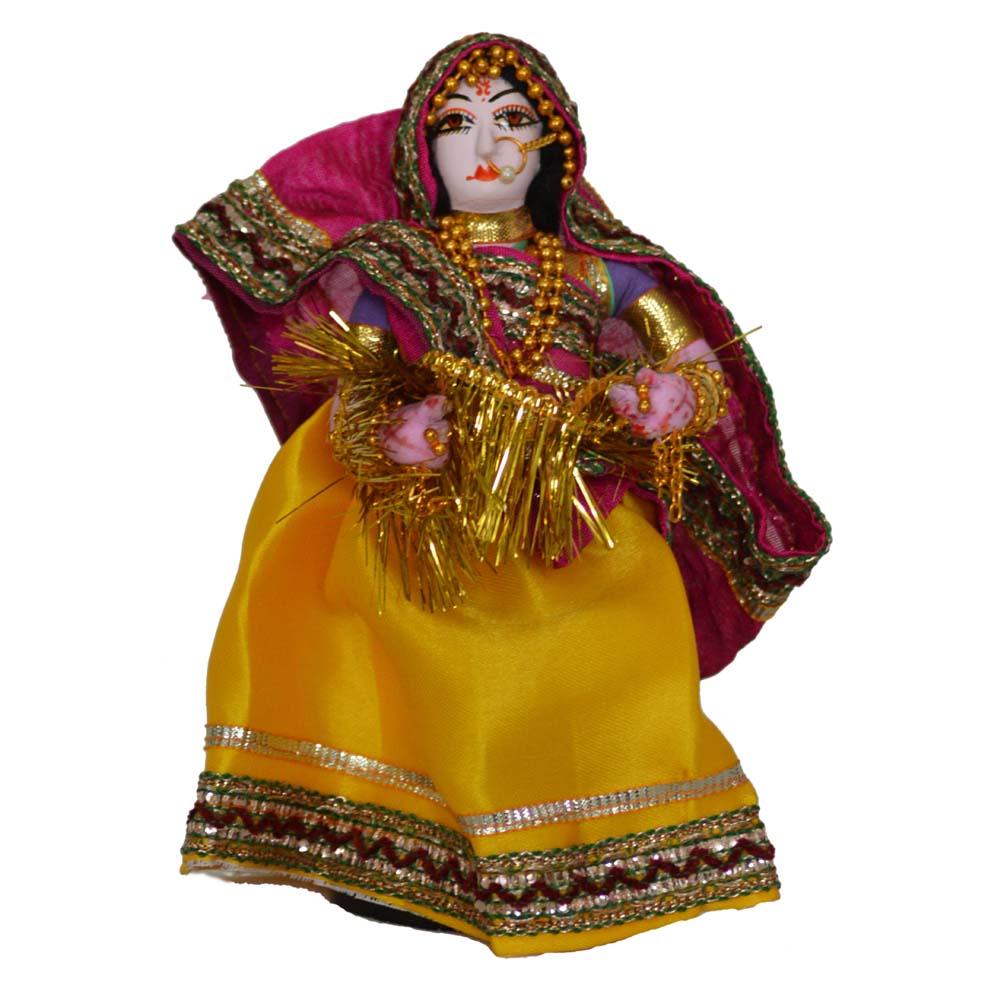 Handcrafted Navaratri costume doll of a lady in a pink blouse and yellow skirt, holding a garland, adorned with intricate detailing.