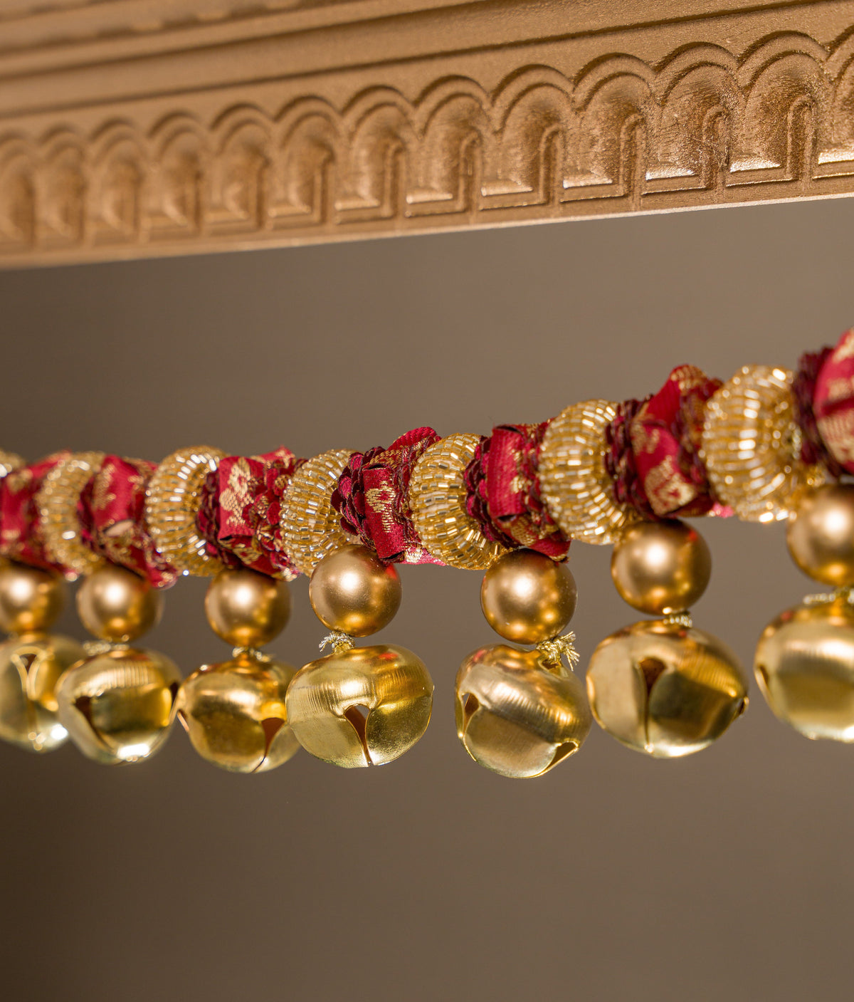 Tonal maroon Banarasi flower toran on solid maroon silk base, with ghunghroos and glass beads — handmade Petite Gajra Toran by IBHI