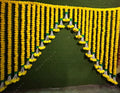 Lemon Marigold Toran With Green leaves and Rajnigandha Flower hanging