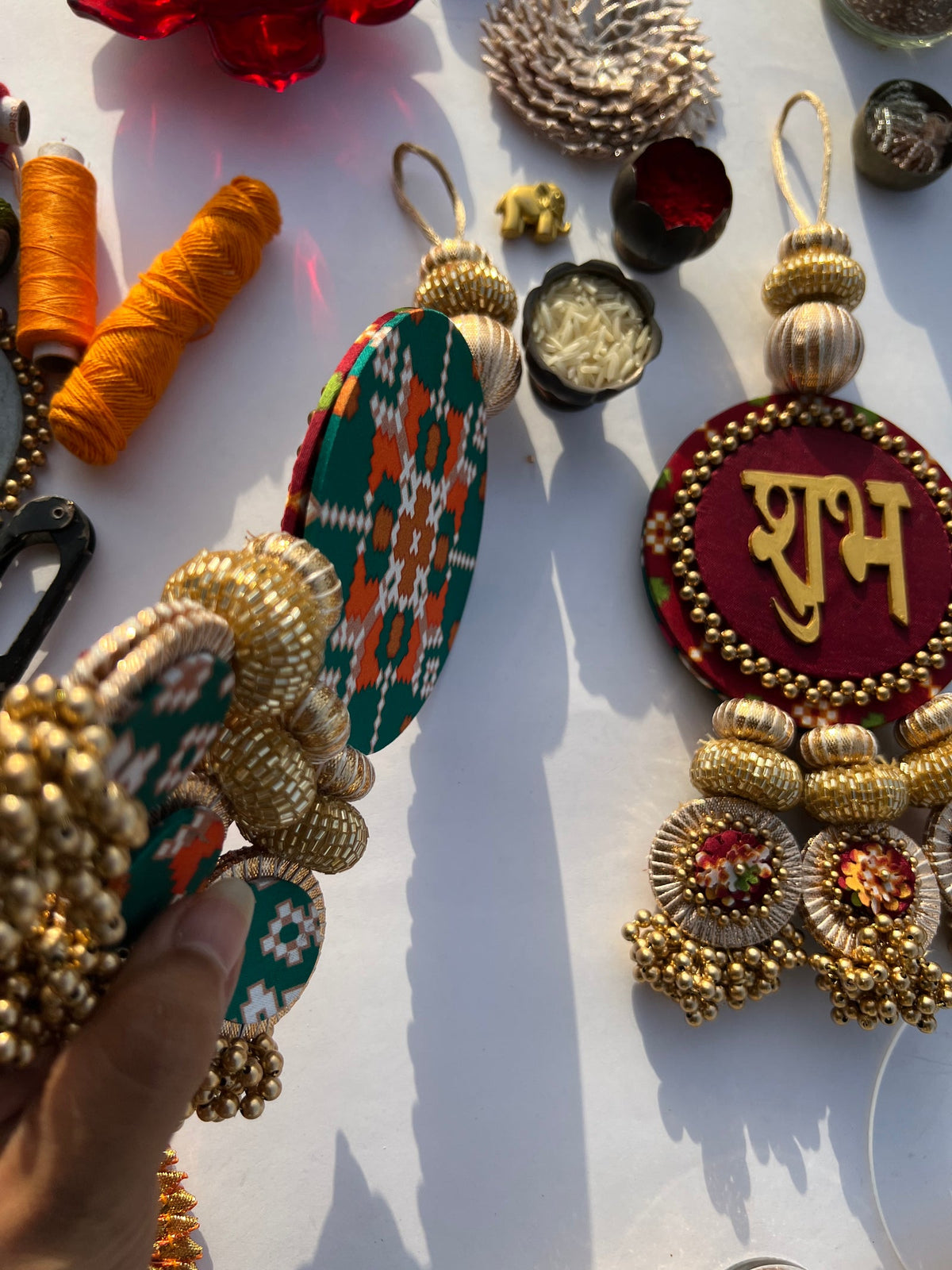 Maroon Shubh Labh hanging pair with beaded tassels