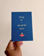 Greeting card that says "Wishing you a diya-light-ful Diwali" above a diya graphic.