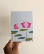 A light bluish green greeting card with lotus flowers and leaves.