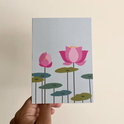 A light bluish green greeting card with lotus flowers and leaves.