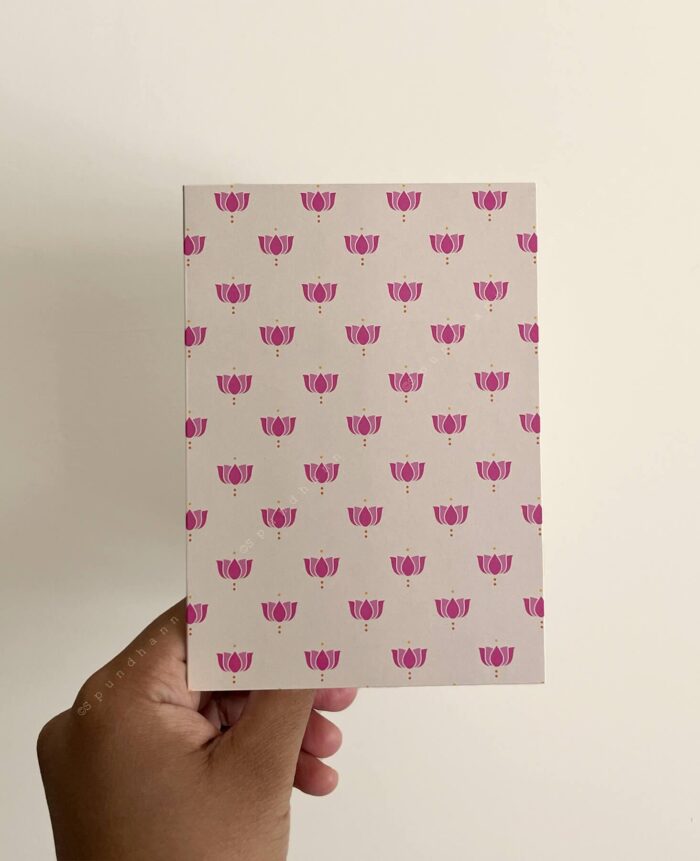 Off white greeting card with pink lotus block print all over.