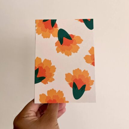 Light off-white greeting card with marigolds all over.