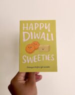 Greeting card with the words Happy Diwali Sweeties and illustrations of laddoos and barfi mittais.